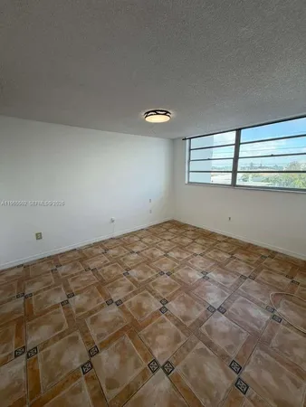 a view of a big room with windows
