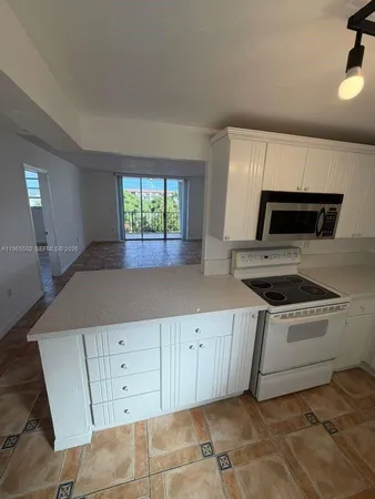 a kitchen with a stove and a sink