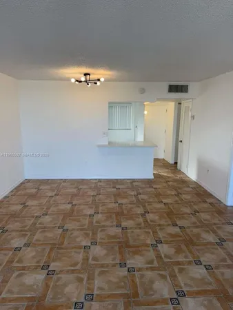 a view of a kitchen with an empty space
