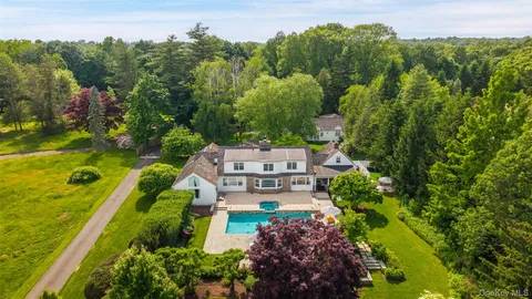 an aerial view of a house with a garden