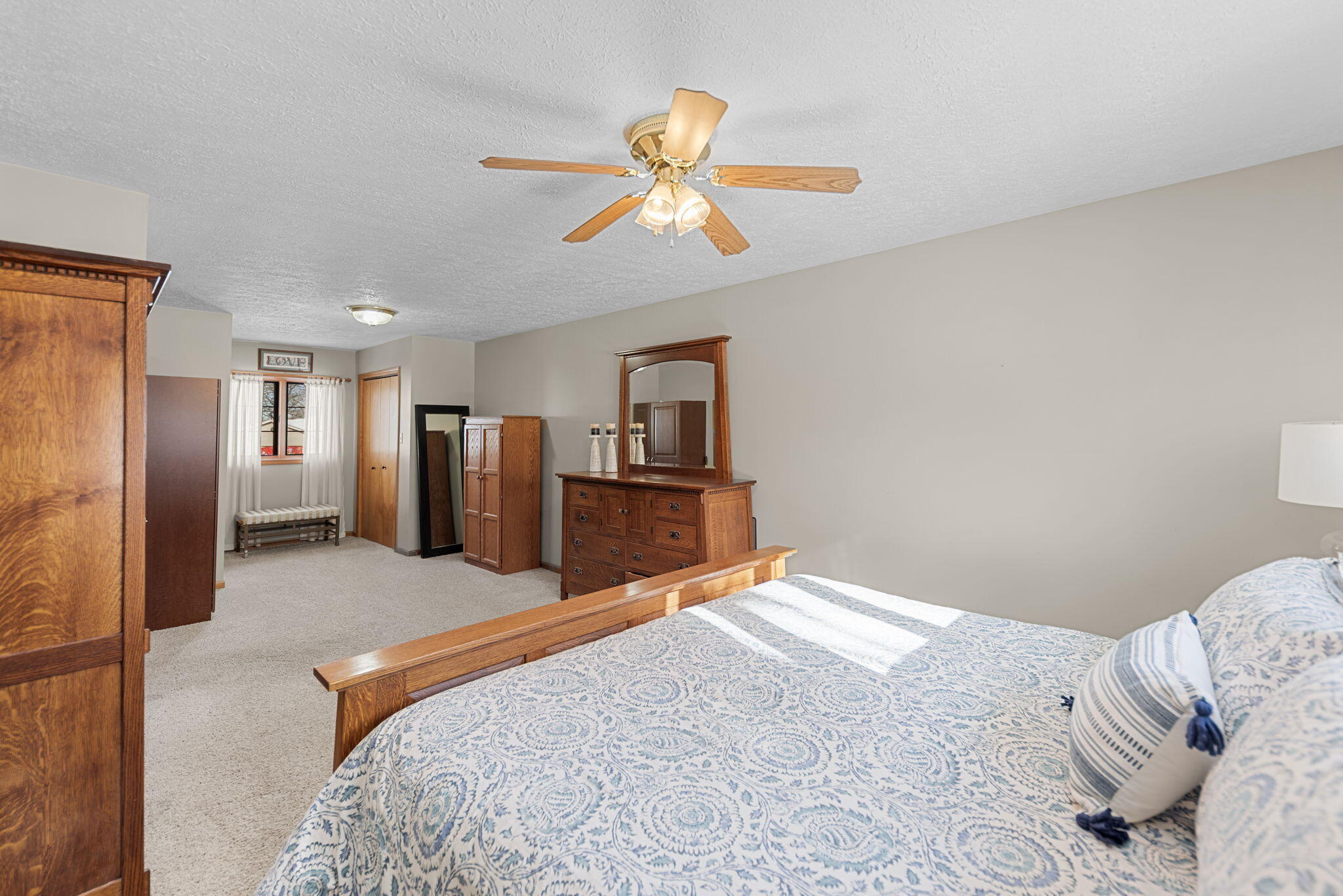 6613 West 86th Court Crown Point, IN 46307 - Photo 12 of 23 a bedroom with a large bed dresser and window