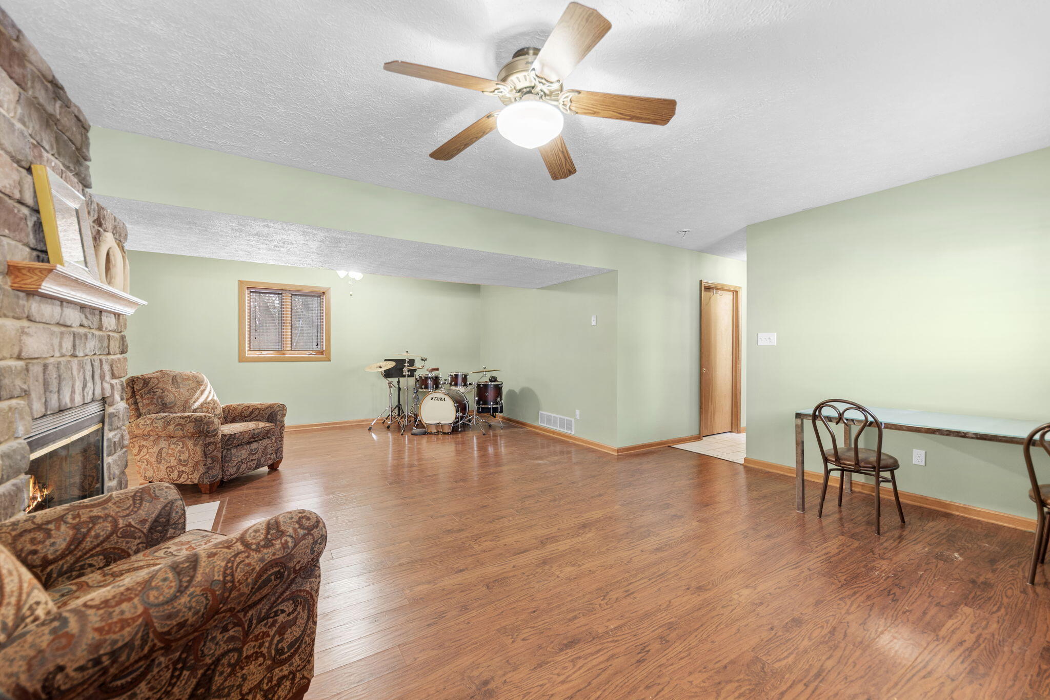 6613 West 86th Court Crown Point, IN 46307 - Photo 15 of 23 a living room with furniture and a wooden floor