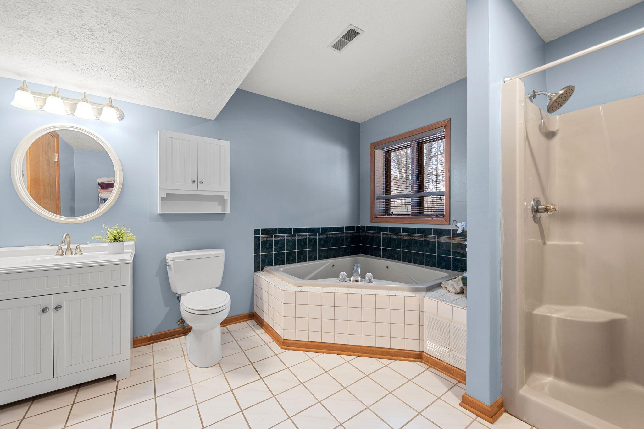 6613 West 86th Court Crown Point, IN 46307 - Photo 17 of 23 a bathroom with a sink toilet and shower