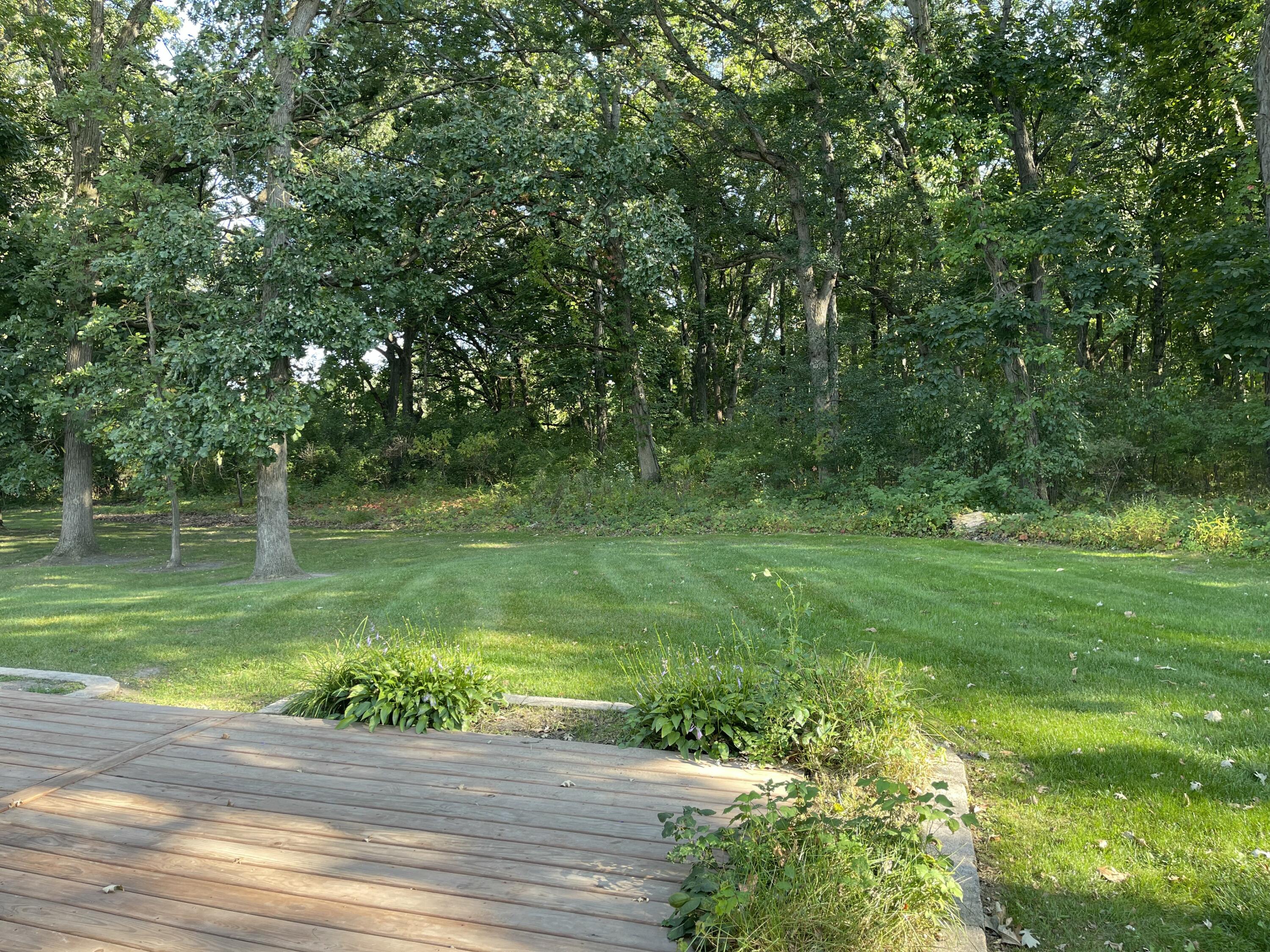 6613 West 86th Court Crown Point, IN 46307 - Photo 23 of 23 a view of a garden with a lake