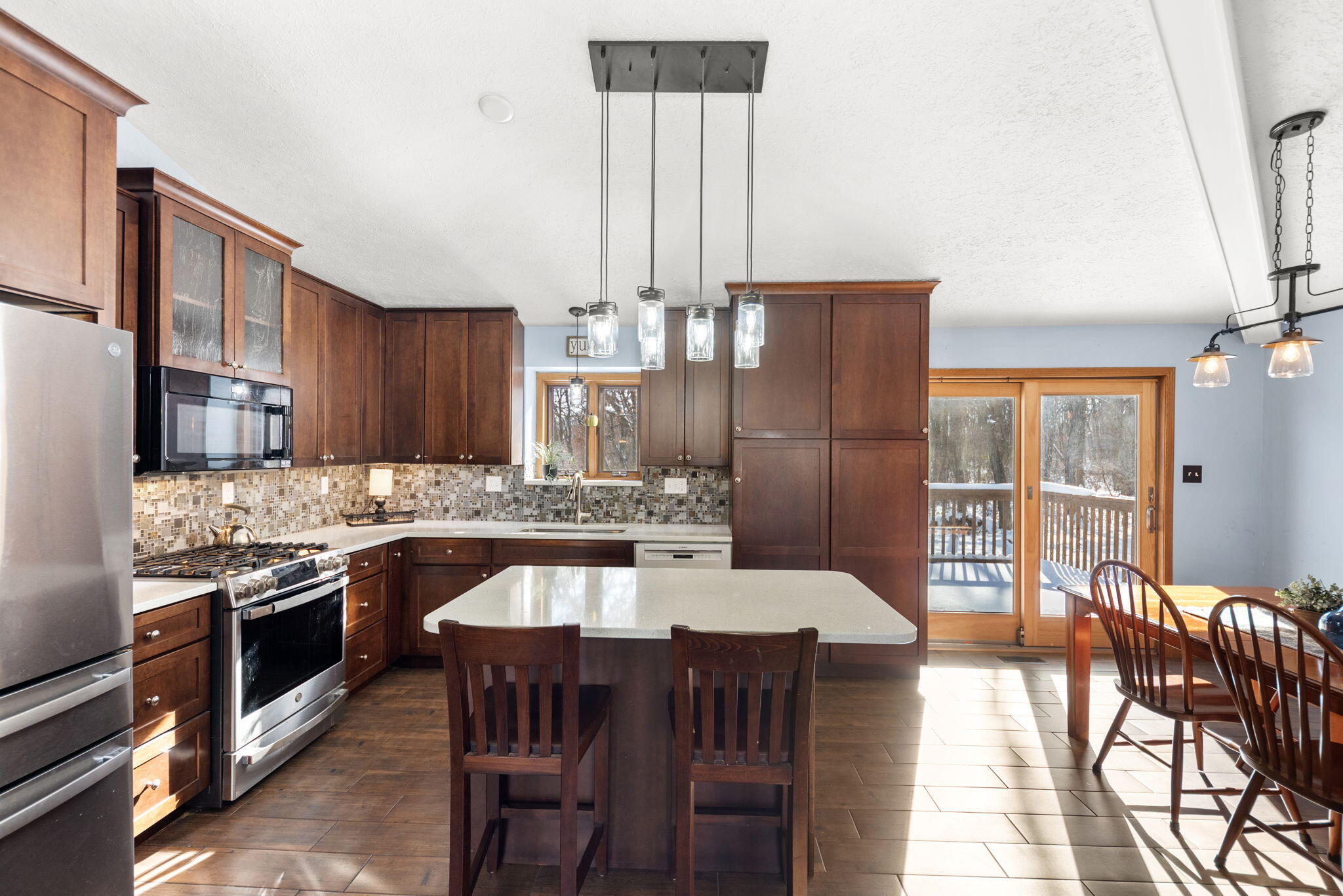 6613 West 86th Court Crown Point, IN 46307 - Photo 8 of 23 a large kitchen with a table and chairs
