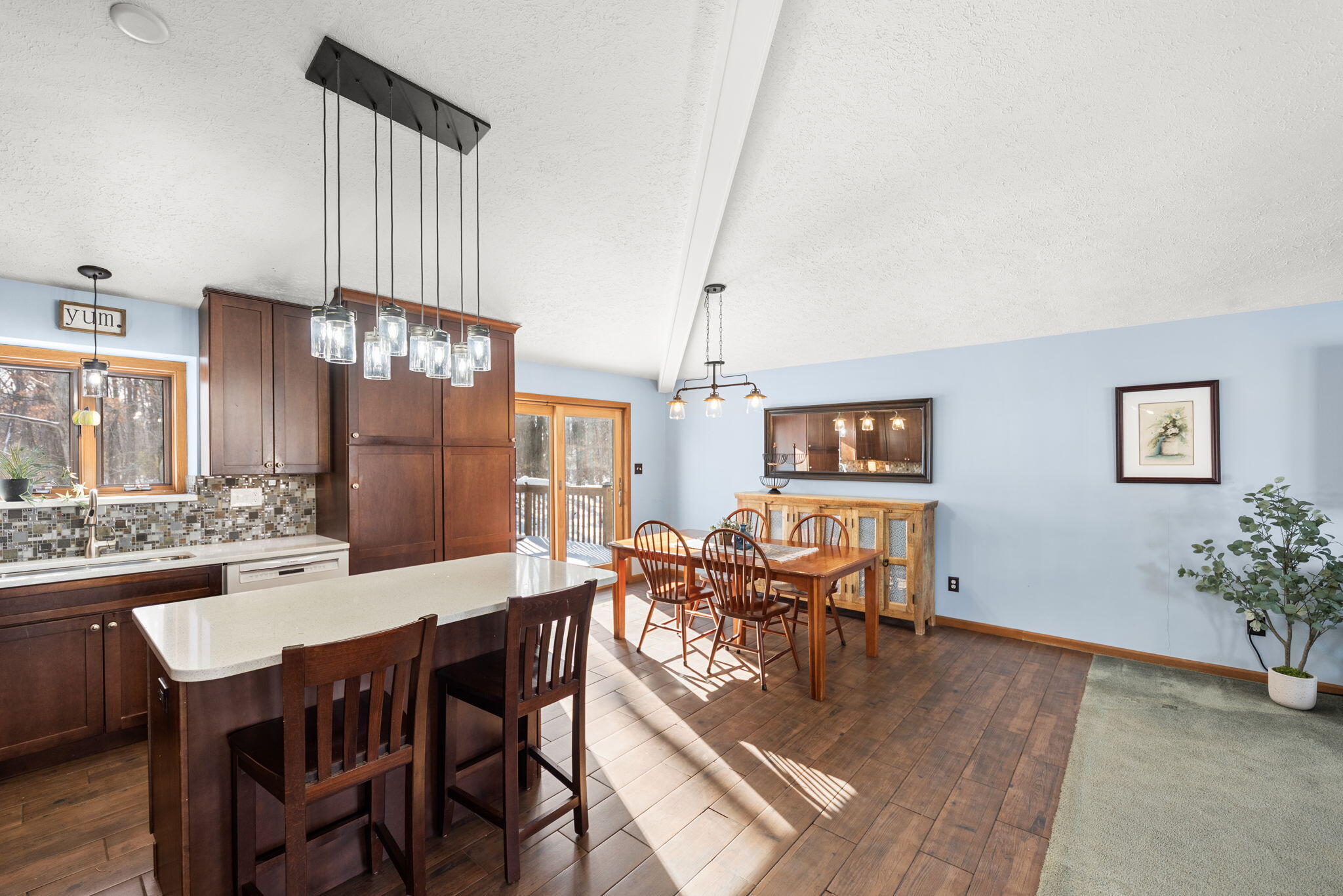 6613 West 86th Court Crown Point, IN 46307 - Photo 9 of 23 a dining room with furniture a chandelier and wooden floor