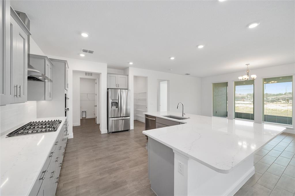 10104 Southwest 106th Circle Ocala, FL 34481 - Photo 21 of 47 a large white kitchen with a refrigerator and a sink