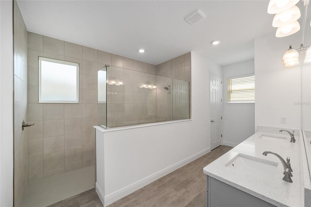 10104 Southwest 106th Circle Ocala, FL 34481 - Photo 27 of 47 a bathroom with a sink and a mirror
