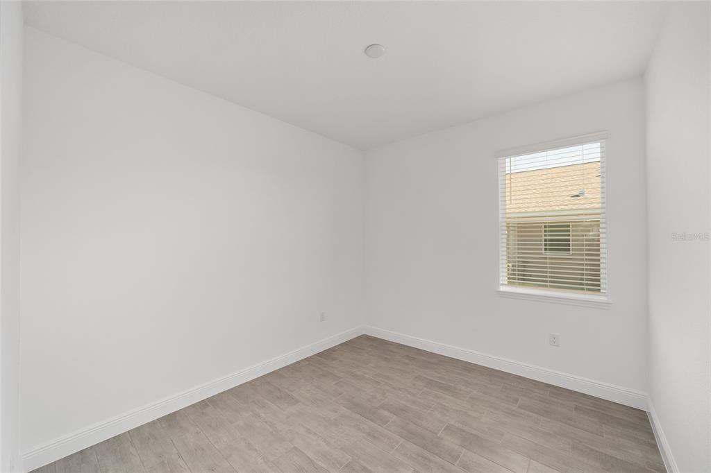 10104 Southwest 106th Circle Ocala, FL 34481 - Photo 31 of 47 an empty room with a window