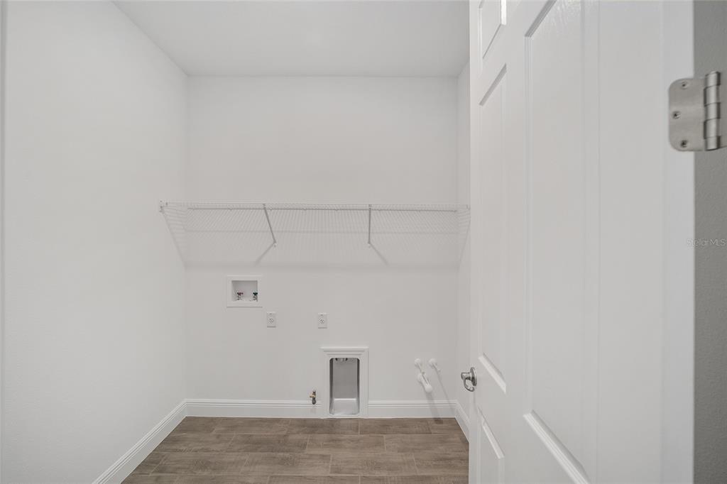 10104 Southwest 106th Circle Ocala, FL 34481 - Photo 39 of 47 a view of a room with racks on the wall