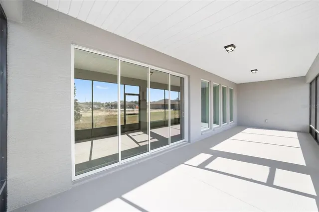 a living room with large windows