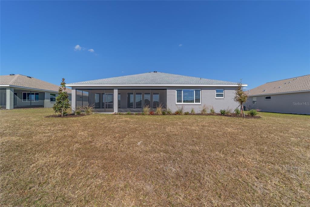 10104 Southwest 106th Circle Ocala, FL 34481 - Photo 46 of 47 a view of a house with a yard