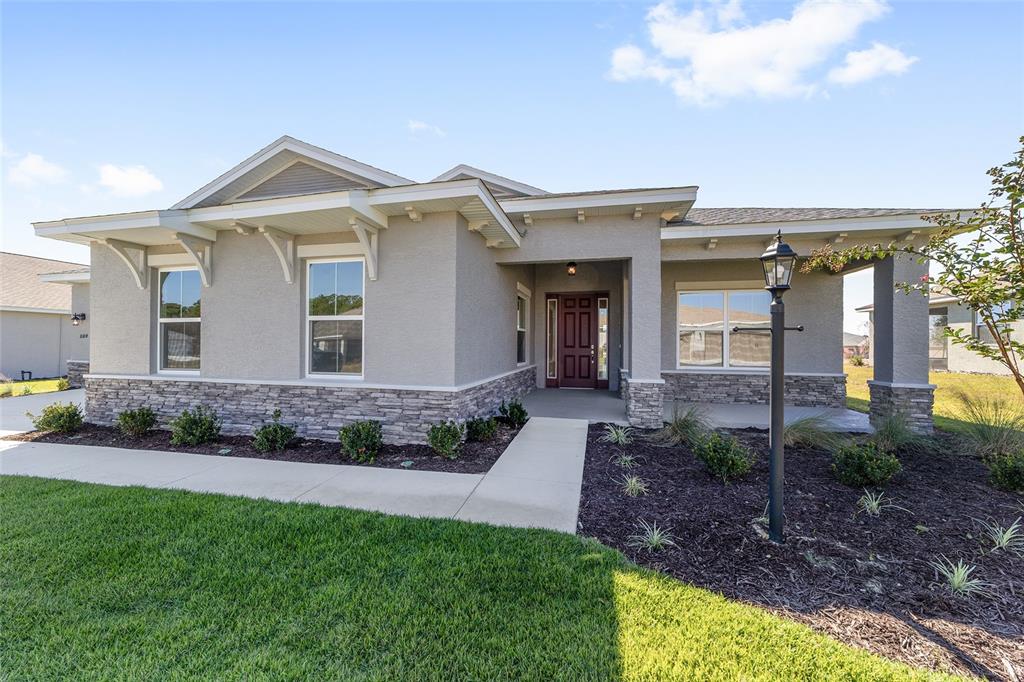 10104 Southwest 106th Circle Ocala, FL 34481 - Photo 6 of 47 a view of a house with a small yard and plants
