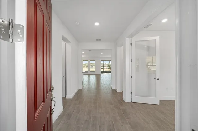 a view of gallery with wooden floor