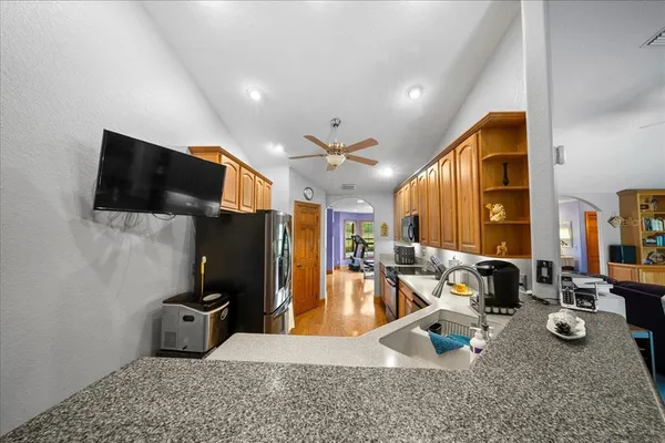a bedroom with bed and a chandelier