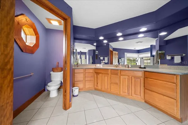 a bathroom with a sink a vanity and a mirror