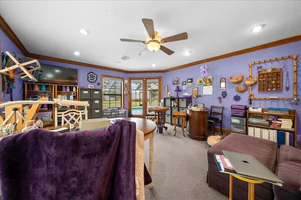 a view of a swimming pool with seating space