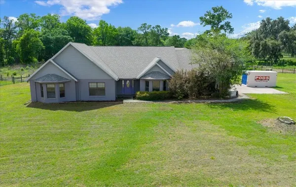 a view of a park with large trees