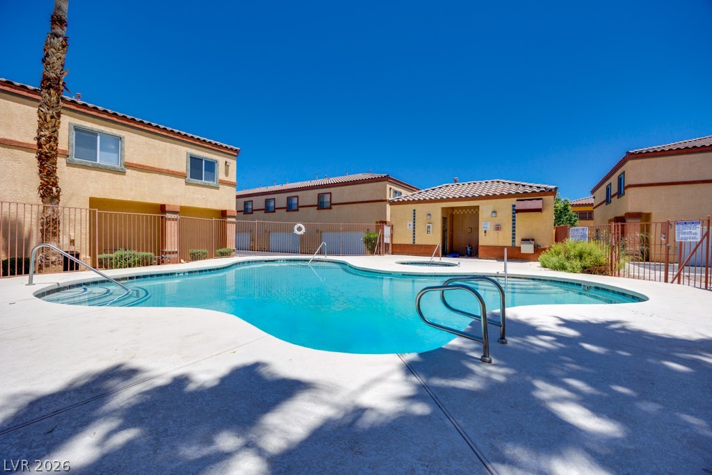 4915 East Russell Road, Unit 127 Las Vegas, NV 89120 - Photo 1 of 19 Swim laps or unwind in the inviting community pool, framed by the desert-toned residences.