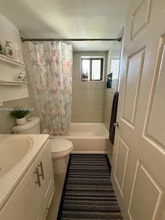 a bathroom with a sink a bathtub and a shower
