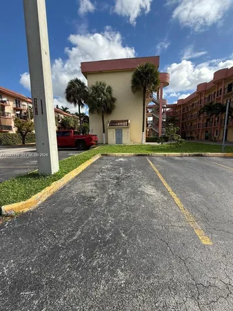 a view of a house with a yard and garage
