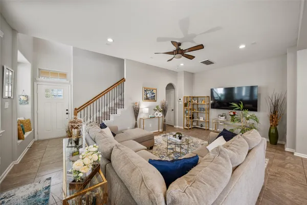 a living room with furniture and a flat screen tv