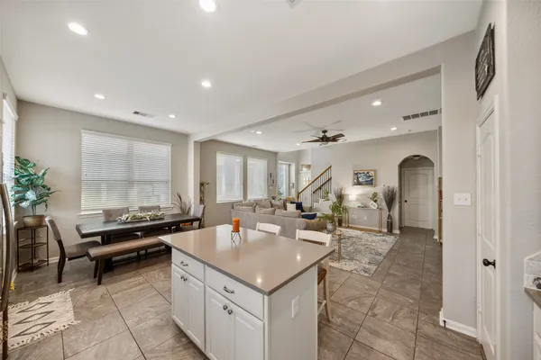 a kitchen with a stove a refrigerator and a sink