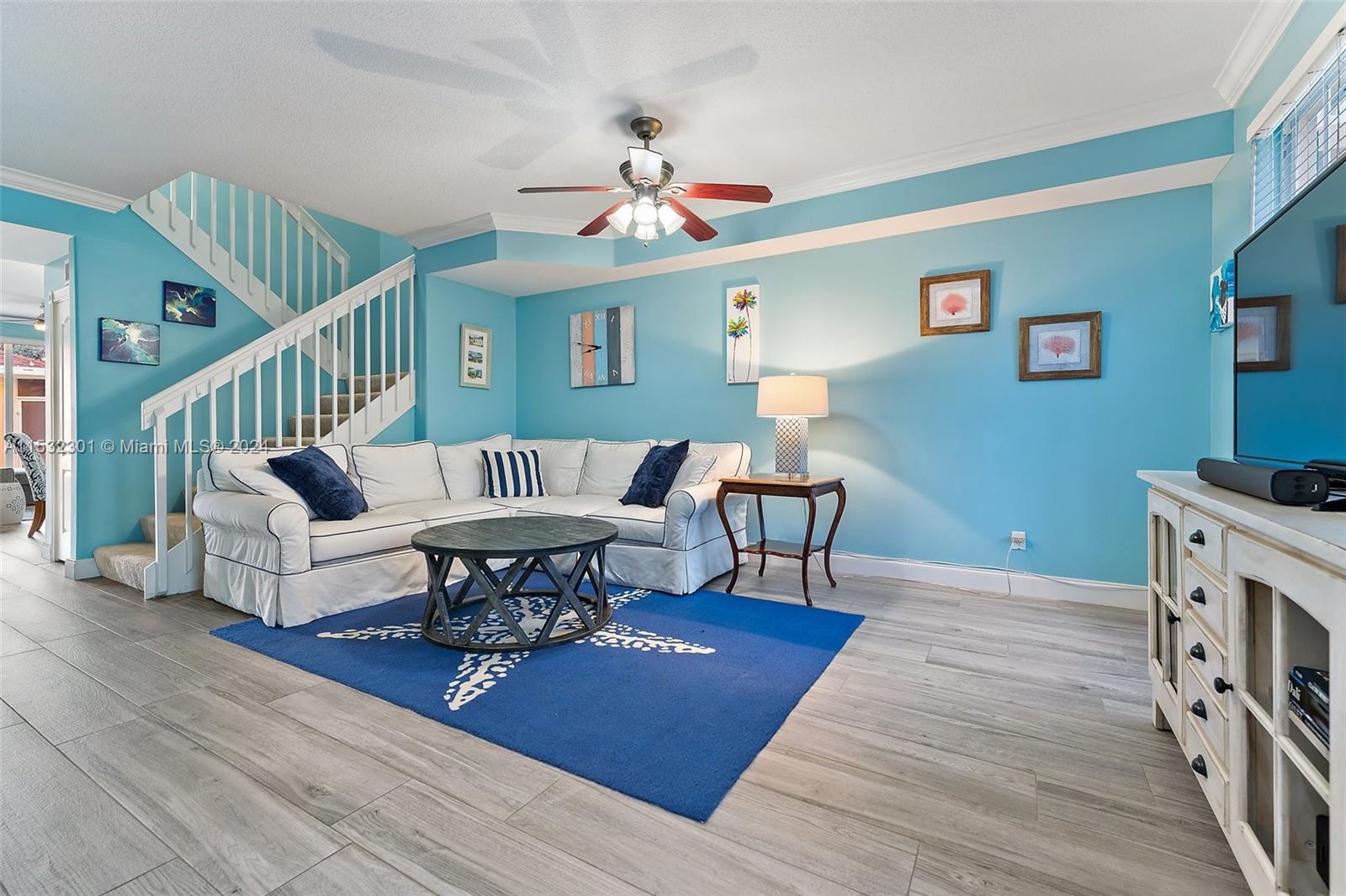 136 Milbridge Drive Jupiter, FL 33458 - Photo 11 of 50 a living room with furniture a dining table and a rug