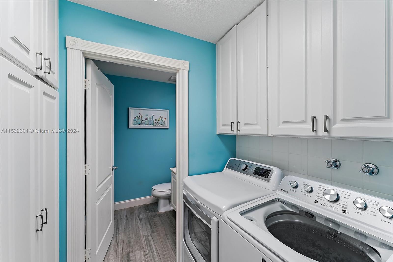 136 Milbridge Drive Jupiter, FL 33458 - Photo 19 of 50 a utility room with dryer and washer