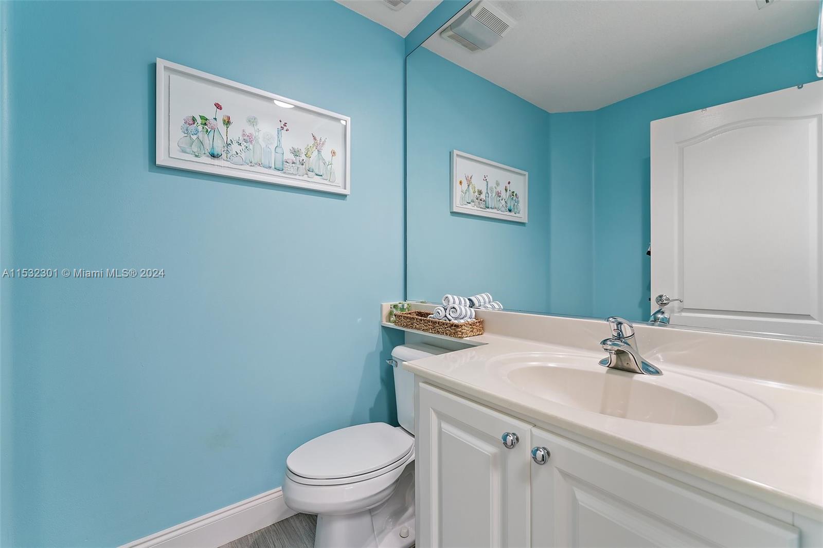 136 Milbridge Drive Jupiter, FL 33458 - Photo 20 of 50 a bathroom with a sink mirror and toilet