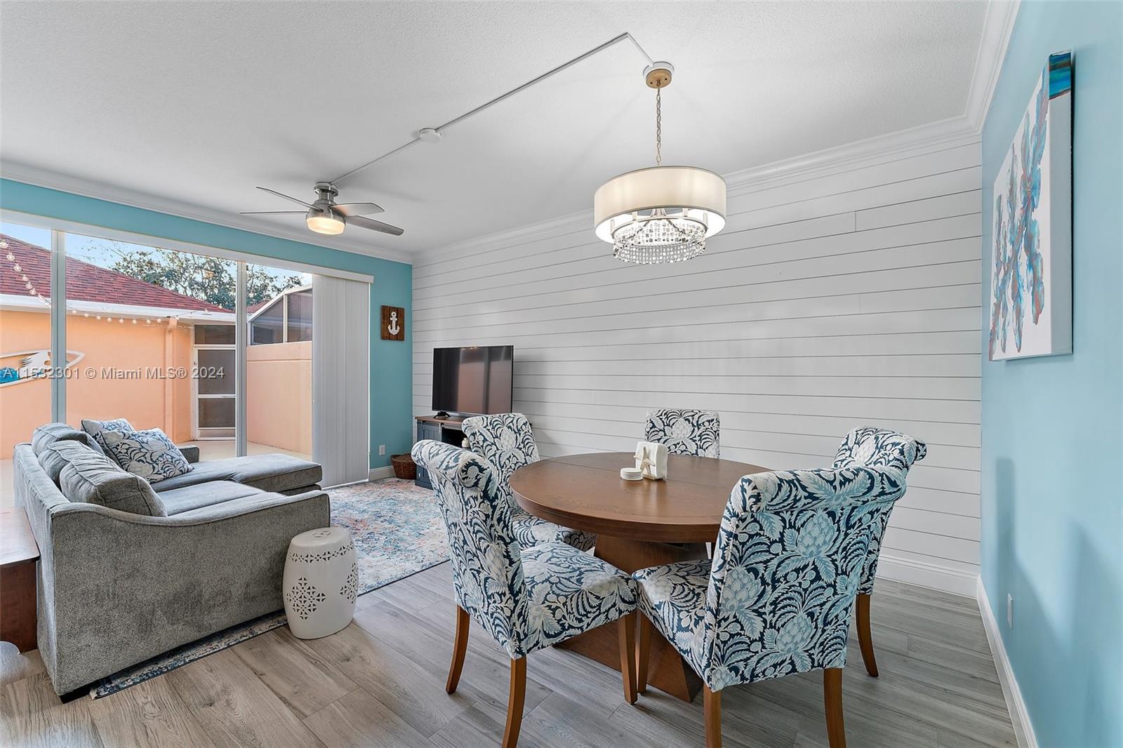 136 Milbridge Drive Jupiter, FL 33458 - Photo 21 of 50 a view of a dining room with furniture wooden floor and chandelier