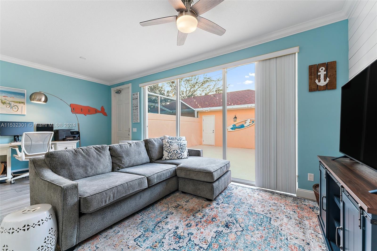 136 Milbridge Drive Jupiter, FL 33458 - Photo 23 of 50 a living room with furniture and a flat screen tv