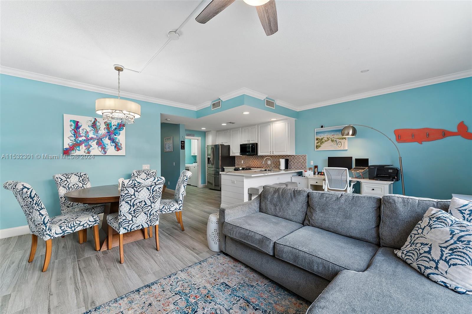 136 Milbridge Drive Jupiter, FL 33458 - Photo 24 of 50 a living room with furniture and wooden floor