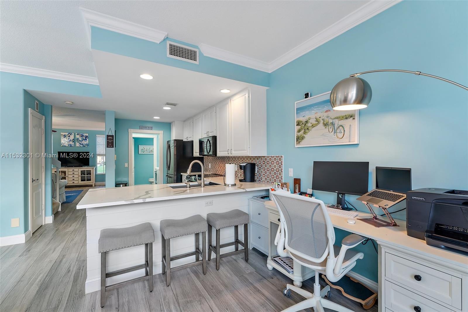 136 Milbridge Drive Jupiter, FL 33458 - Photo 26 of 50 a view of a dining room with furniture and wooden floor