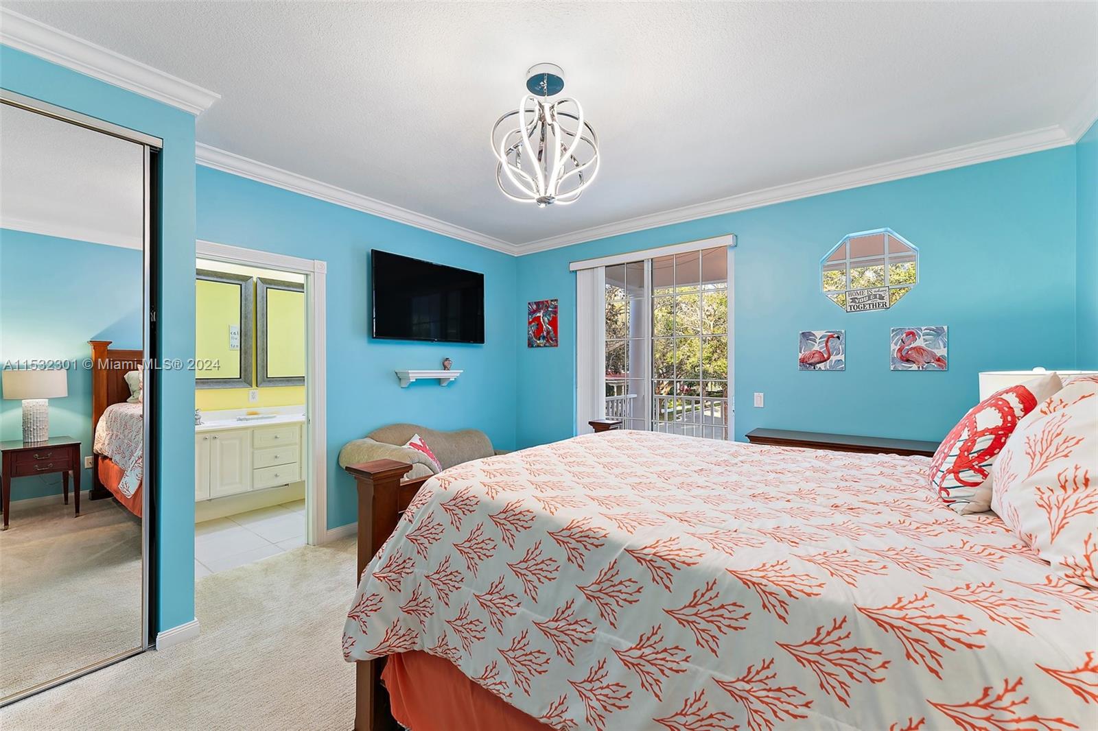 136 Milbridge Drive Jupiter, FL 33458 - Photo 29 of 50 a bedroom with a bed and a flat tv screen on dresser