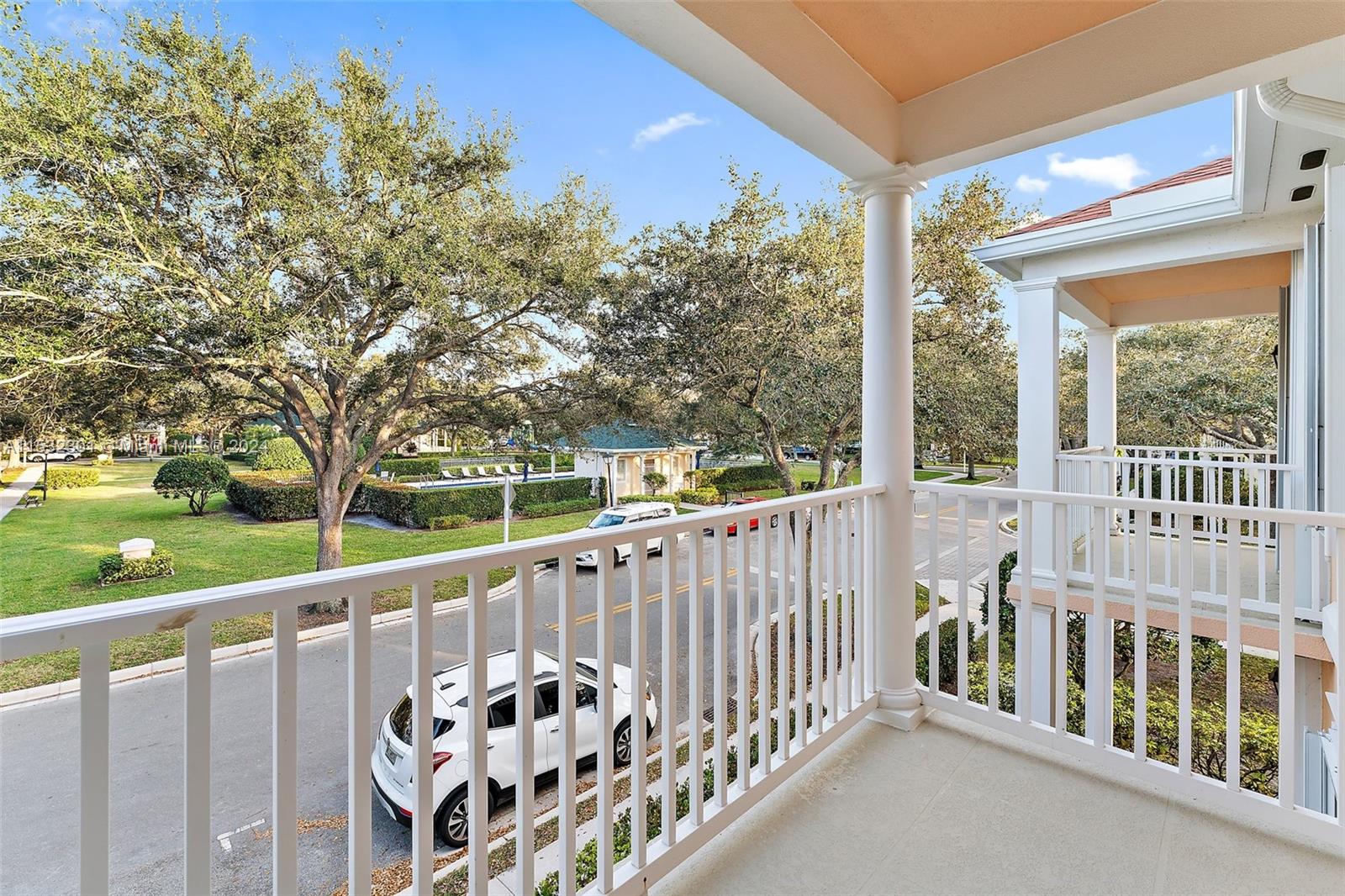 136 Milbridge Drive Jupiter, FL 33458 - Photo 31 of 50 a view of a wooden deck next to a yard