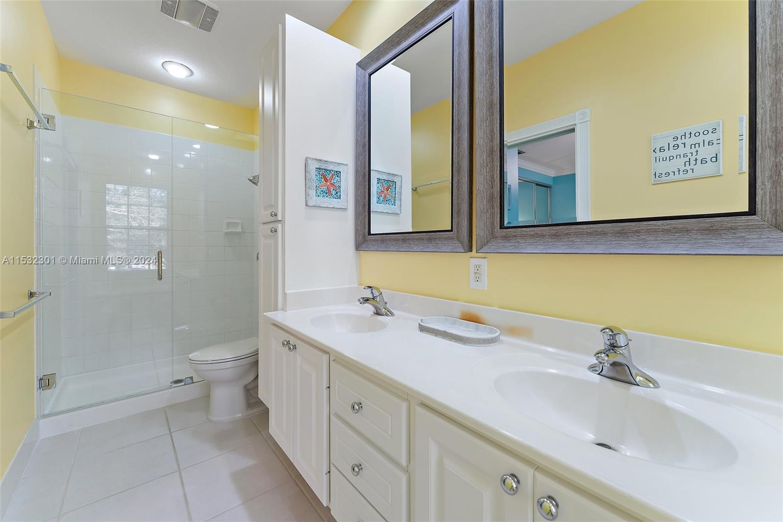 136 Milbridge Drive Jupiter, FL 33458 - Photo 34 of 50 a spacious bathroom with a toilet sink and mirror