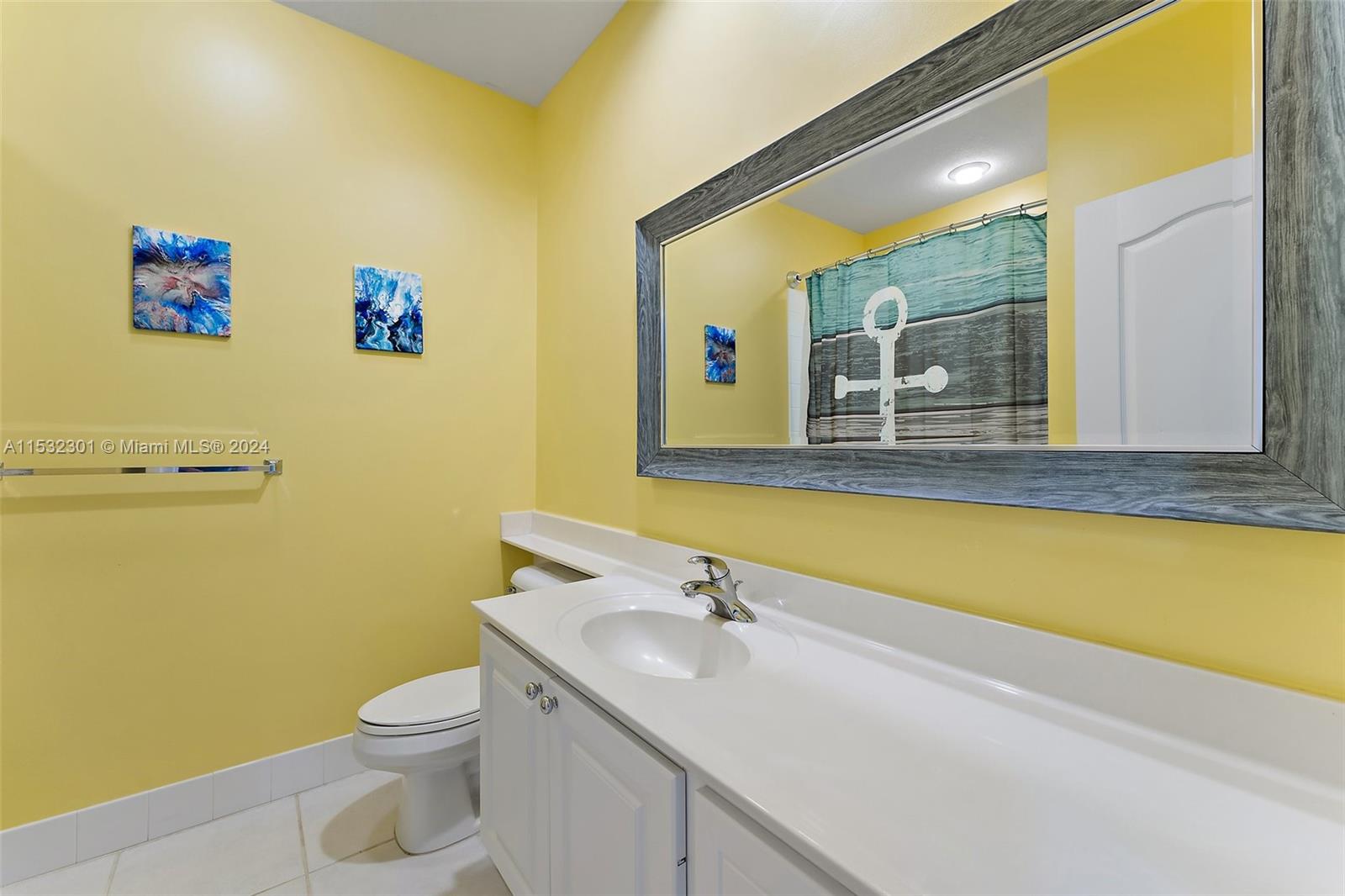 136 Milbridge Drive Jupiter, FL 33458 - Photo 36 of 50 a bathroom with a sink and a mirror