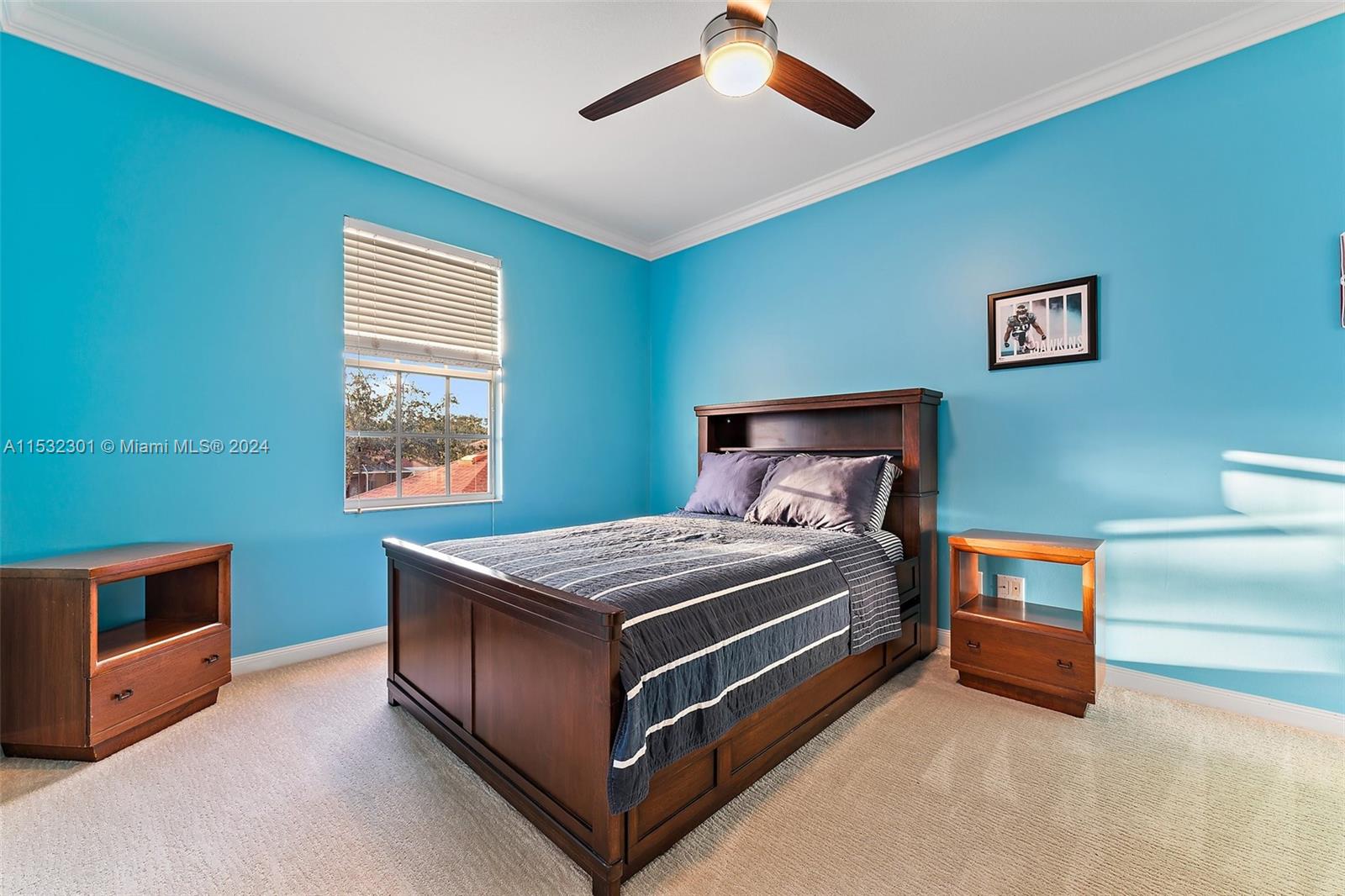 136 Milbridge Drive Jupiter, FL 33458 - Photo 37 of 50 a bedroom with a bed and a tv