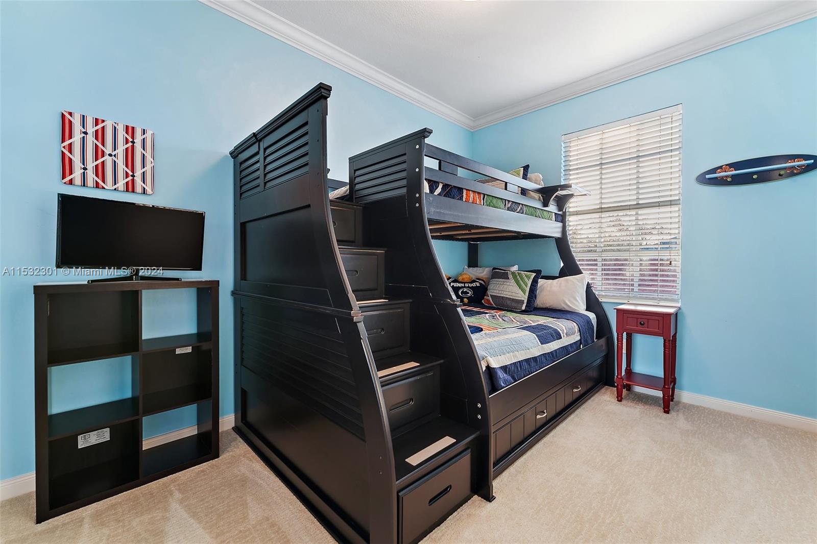 136 Milbridge Drive Jupiter, FL 33458 - Photo 40 of 50 a bedroom with a bed and a flat tv screen on the dresser