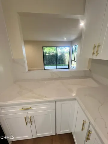a view of a kitchen with furniture and window