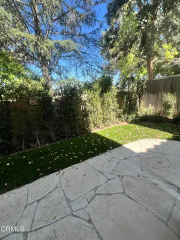 a view of backyard with green space