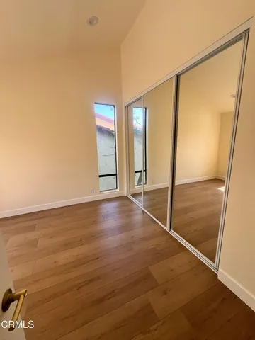 a view of an empty room with glass door