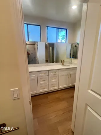 a kitchen with stainless steel appliances a refrigerator and cabinets