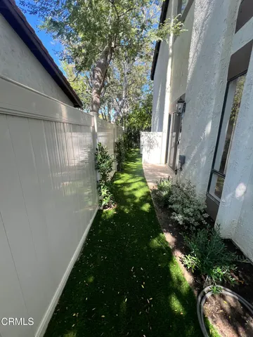 a backyard of a house with lots of green space