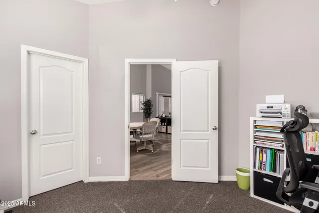 a view of a study room with workspace