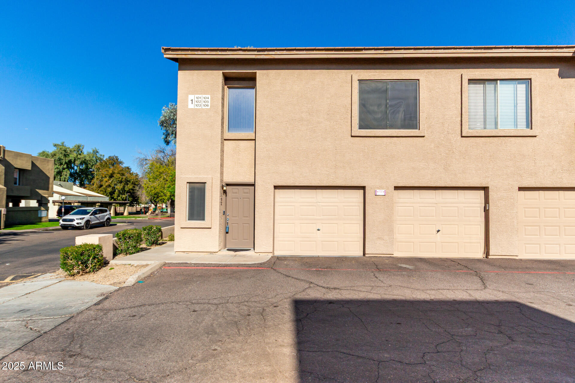 1406 West Emerald Avenue, Unit 102 Mesa, AZ 85202 - Photo 20 of 21 a view of a house with a outdoor space