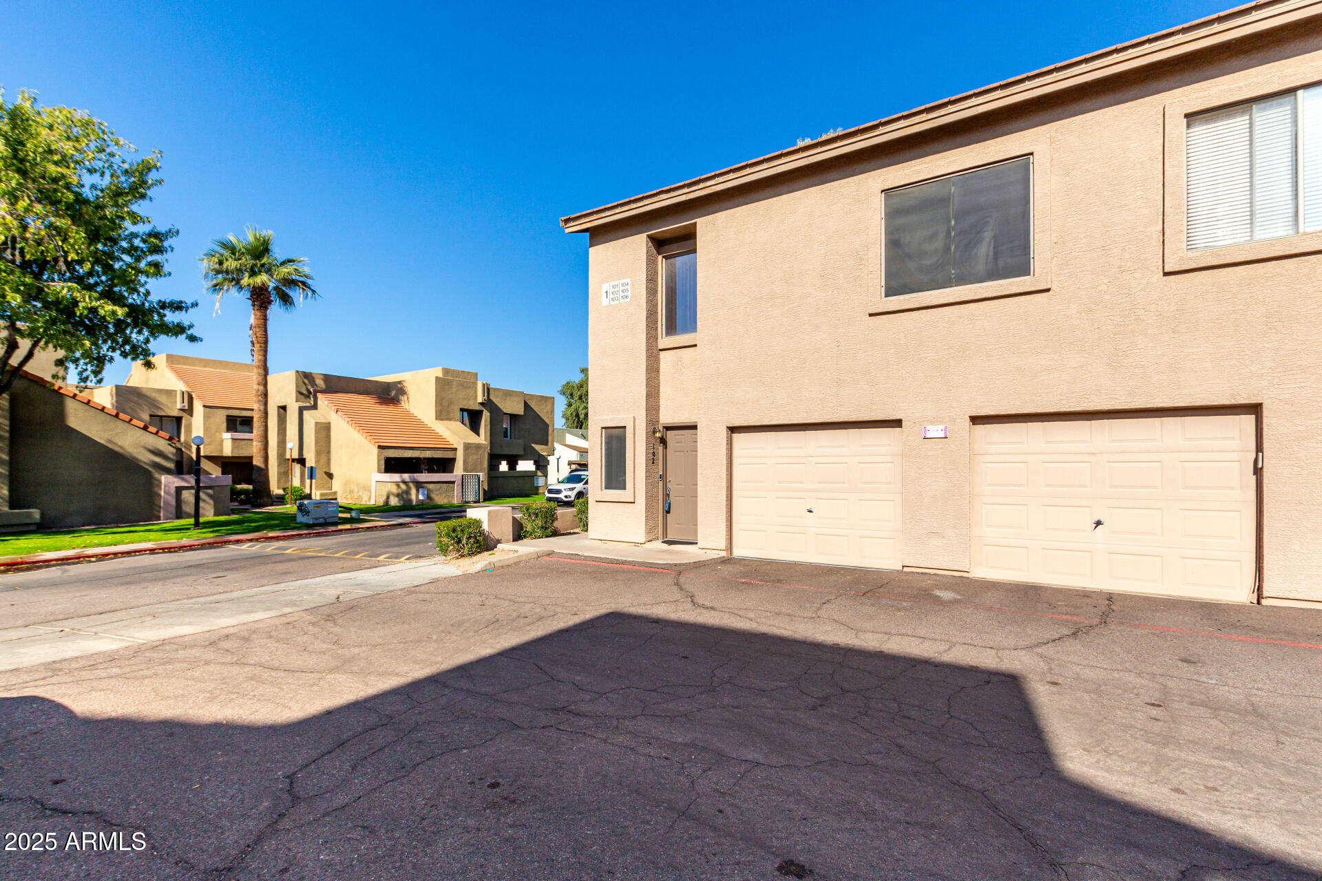 1406 West Emerald Avenue, Unit 102 Mesa, AZ 85202 - Photo 21 of 21 a view of a house with a street