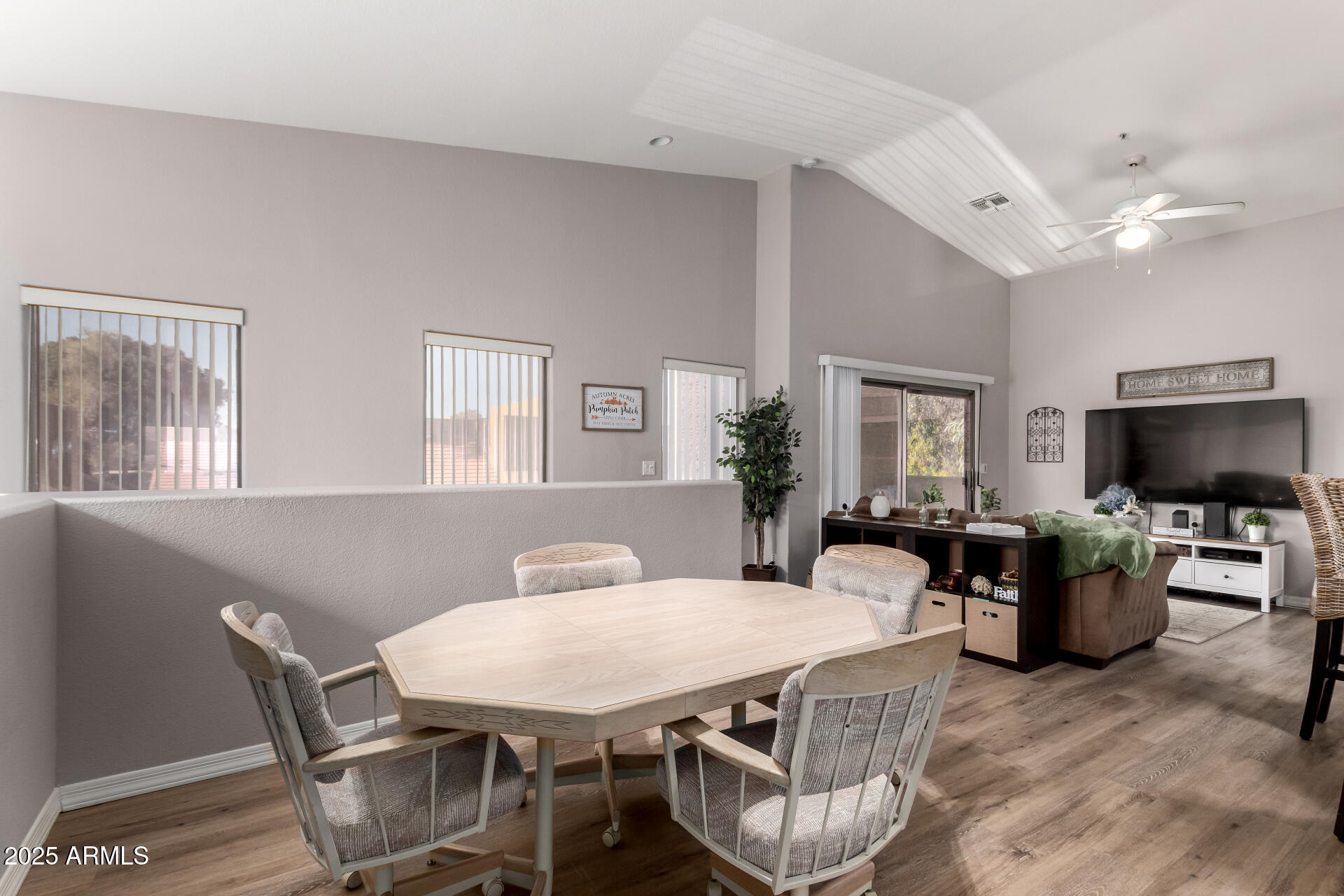 1406 West Emerald Avenue, Unit 102 Mesa, AZ 85202 - Photo 3 of 21 a view of a dining room with furniture