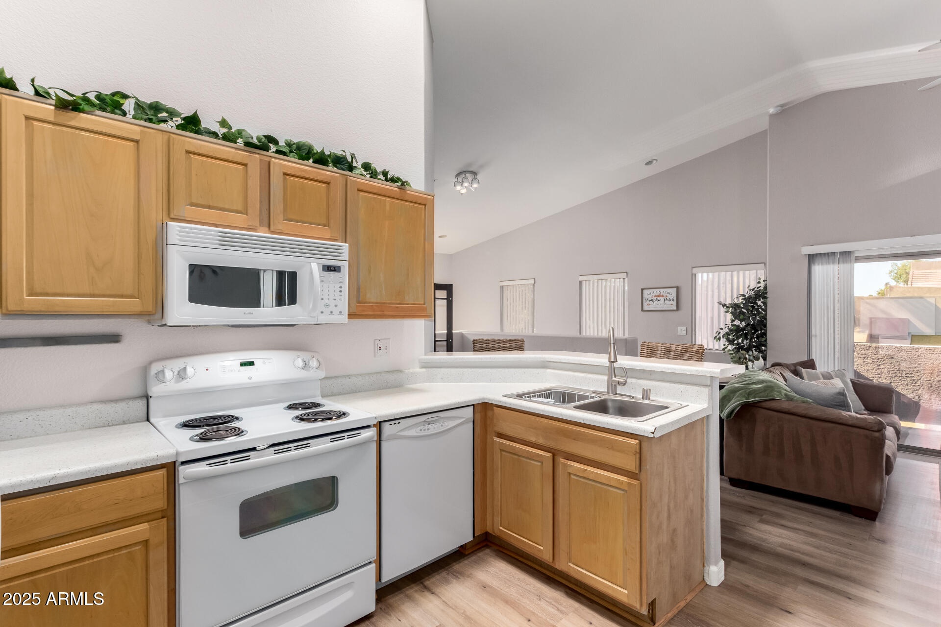 1406 West Emerald Avenue, Unit 102 Mesa, AZ 85202 - Photo 7 of 21 a kitchen with stainless steel appliances a stove sink and cabinets